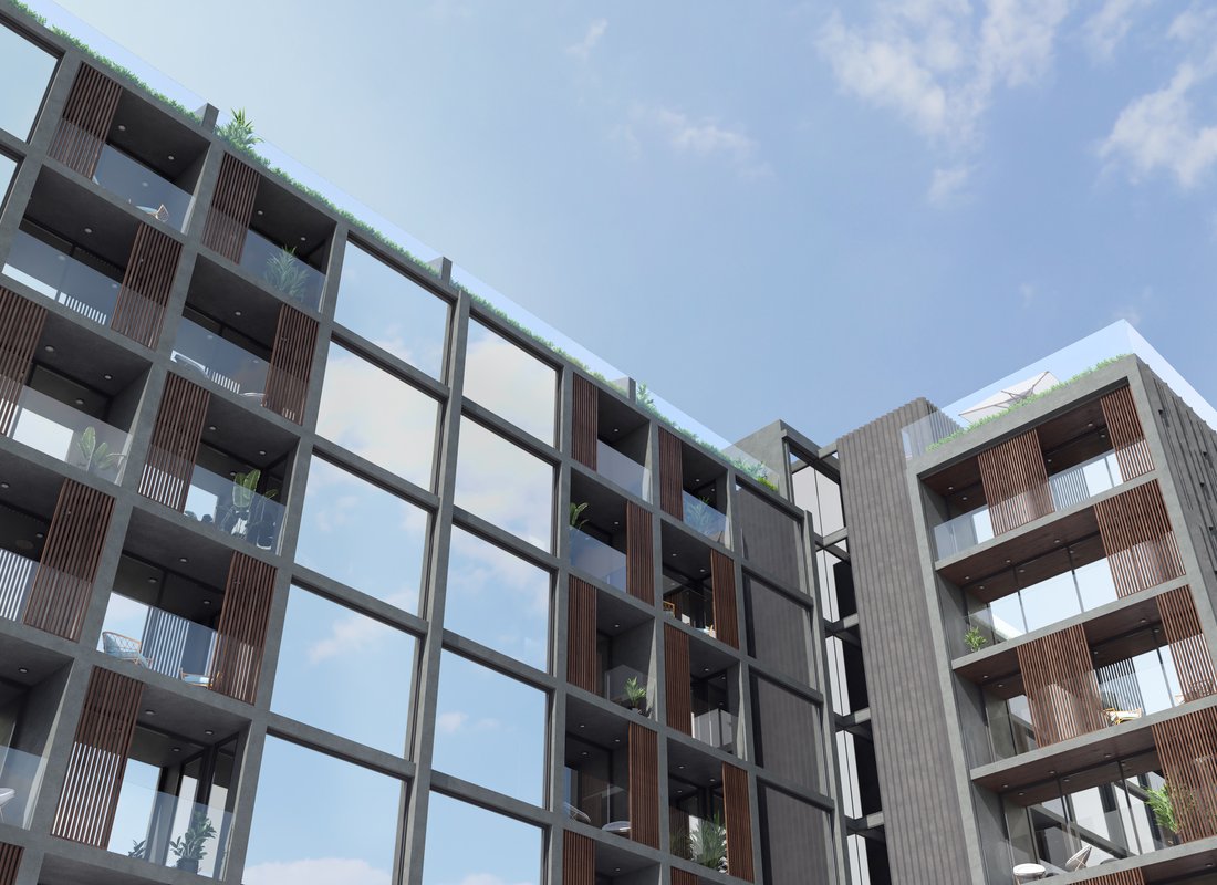 Essence — low-angle view of the facade